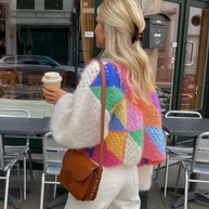 Gestreifte offene Strickjacke