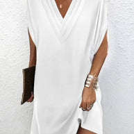 Elegantes Kleid mit geschlitzten Ärmeln