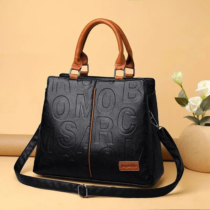 WW – Damenhandtasche aus weichem Leder mit geprägtem Buchstabendesign