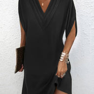 Elegantes Kleid mit geschlitzten Ärmeln