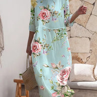 Elegantes Blumenmusterkleid, das den Bauch Bedeckt