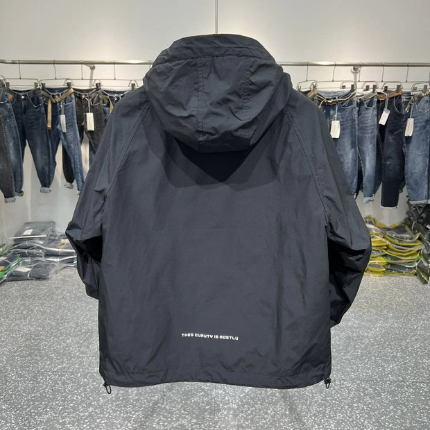 WW | Leichter Kapuzen Windbreaker mit halbem Reißverschluss und Tasche