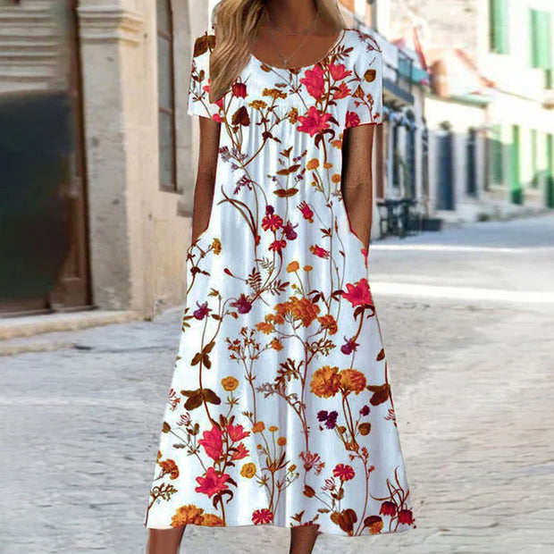 WW – Maxikleid im Bohemian-Stil mit Blumenmuster und Taschen | Kurzärmliges Maxikleid mit Blumenmuster im Boho-Chic-Stil für Damen