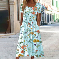 WW – Maxikleid im Bohemian-Stil mit Blumenmuster und Taschen | Kurzärmliges Maxikleid mit Blumenmuster im Boho-Chic-Stil für Damen