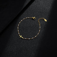 WW | Goldfarbene Kreuzarmband
