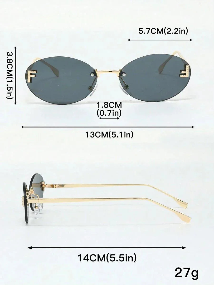 W&W Mode | Ovale Sonnenbrille Mit Goldenen Akzenten Und Subtilen Steinen