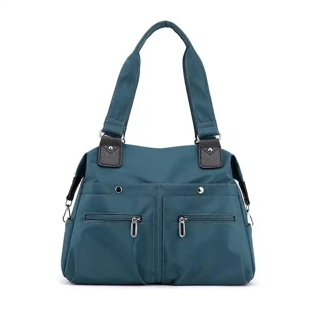 Blau wasserdichte Umhängetasche mit mehreren Taschen und abnehmbarem Riemen