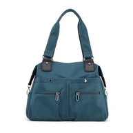 Blau wasserdichte Umhängetasche mit mehreren Taschen und abnehmbarem Riemen