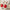 Pelzpantoffel mit rotem Smiley-Design