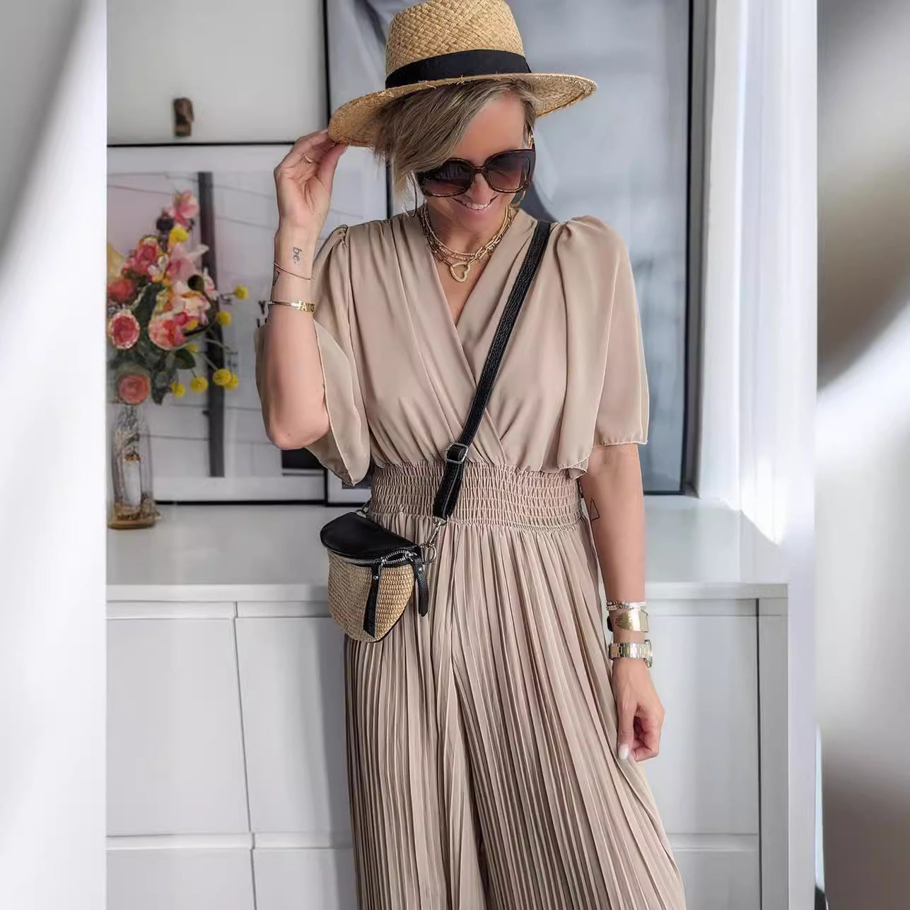 Damen Eleganter Jumpsuit mit tiefem V-Ausschnitt und voluminösen Ärmeln WW