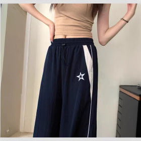 Damen Sportliche Weite Hose mit seitlichen Streifen und elastischem Bund W&W Mode