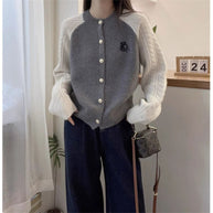 Damen Strickjacke mit dekorativen Zopfmustern WW