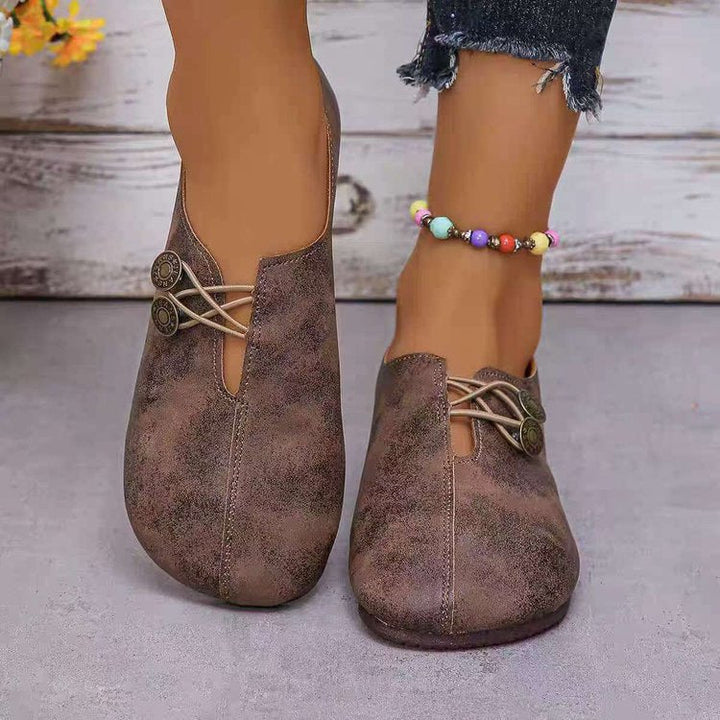 Damen Komfortable und stilvolle Slipper mit dekorativen Schnürdetails W&W Mode