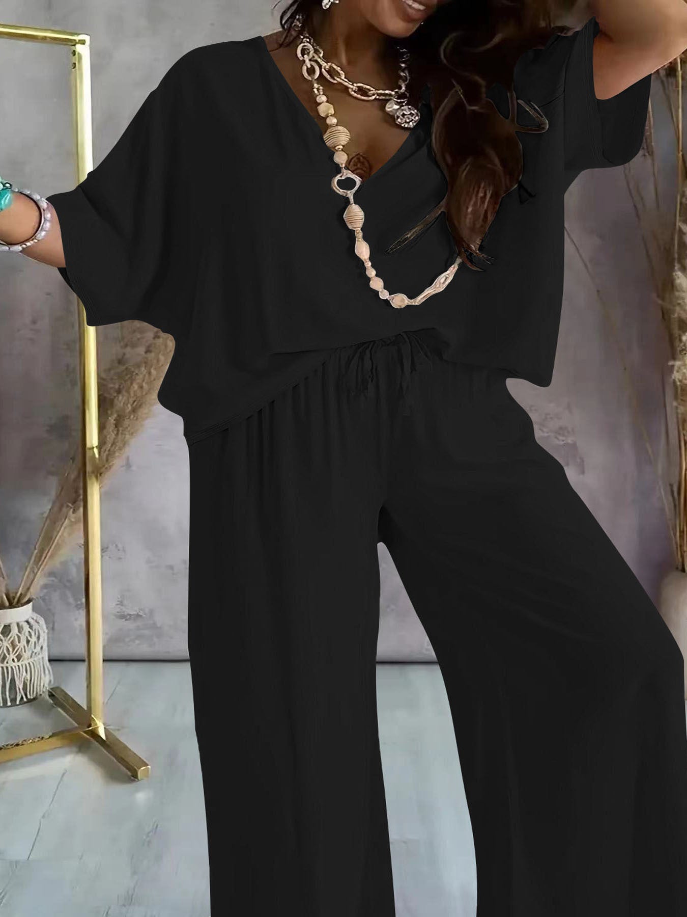 Damen eleganter Jumpsuit mit V-Ausschnitt und weitem Bein WW