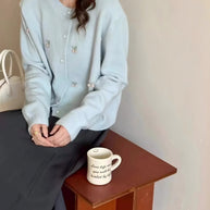 Damen Strickjacke mit verspieltem Design und Perlenknöpfen WW
