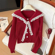 Damen Strickjacke mit Rüschen-Halsband und dekorativen Knöpfen WW