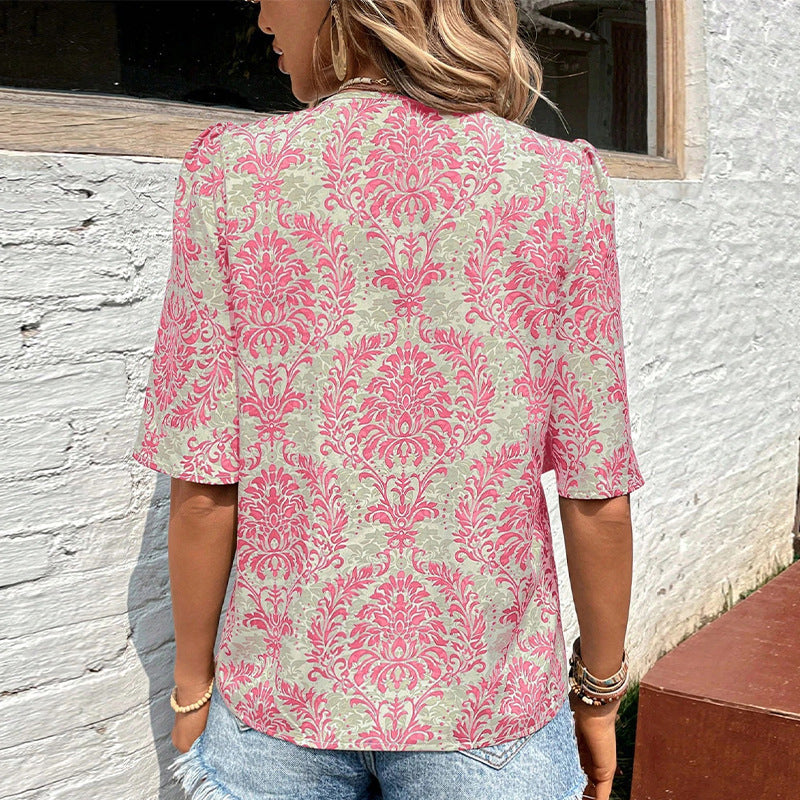 Damen Bluse mit volumetrischen Ärmeln und floralen Mustern WW