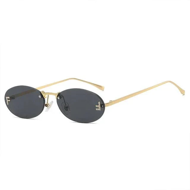 W&W Mode | Ovale Sonnenbrille Mit Goldenen Akzenten Und Subtilen Steinen