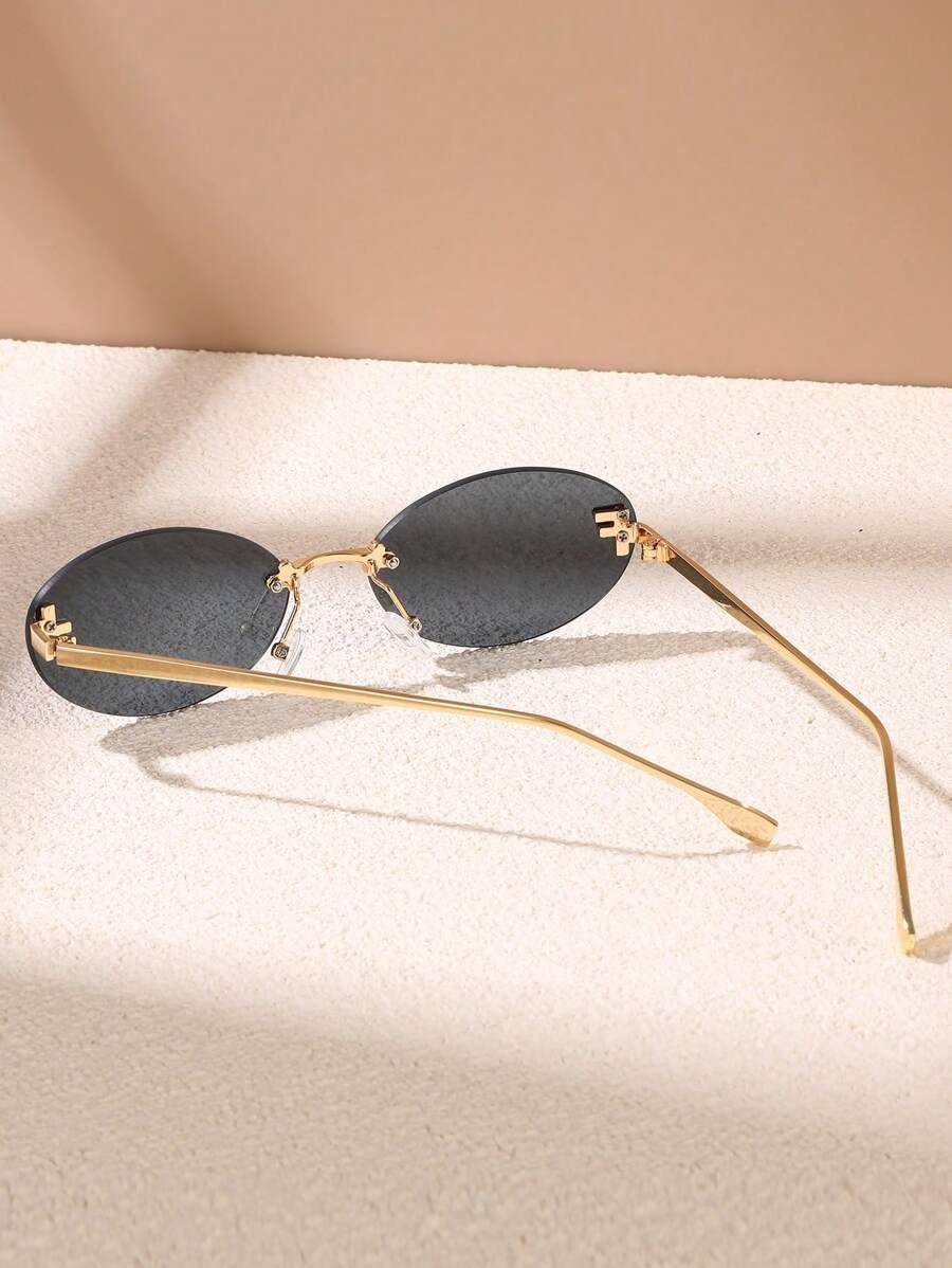 WW | Ovale Sonnenbrille Mit Goldenen Akzenten Und Subtilen Steinen
