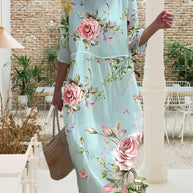 Elegantes Blumenmusterkleid, das den Bauch Bedeckt