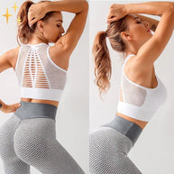 WW | Sport-BH Top mit gekreuzten Trägern und Netzrücken aus luftigem dehnbarem Material