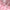 Paillettendetails auf einem rosa cocktailkleid
